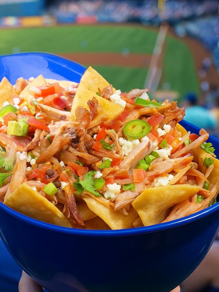 Carnitas Nachos topped with Bacon