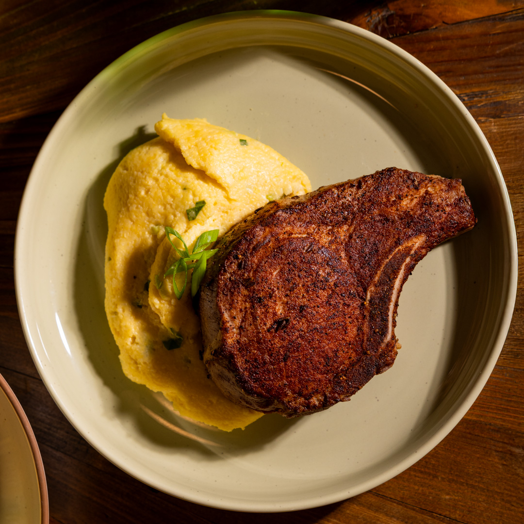 Blackened Pork Chops with Cheesy Bacon Grits